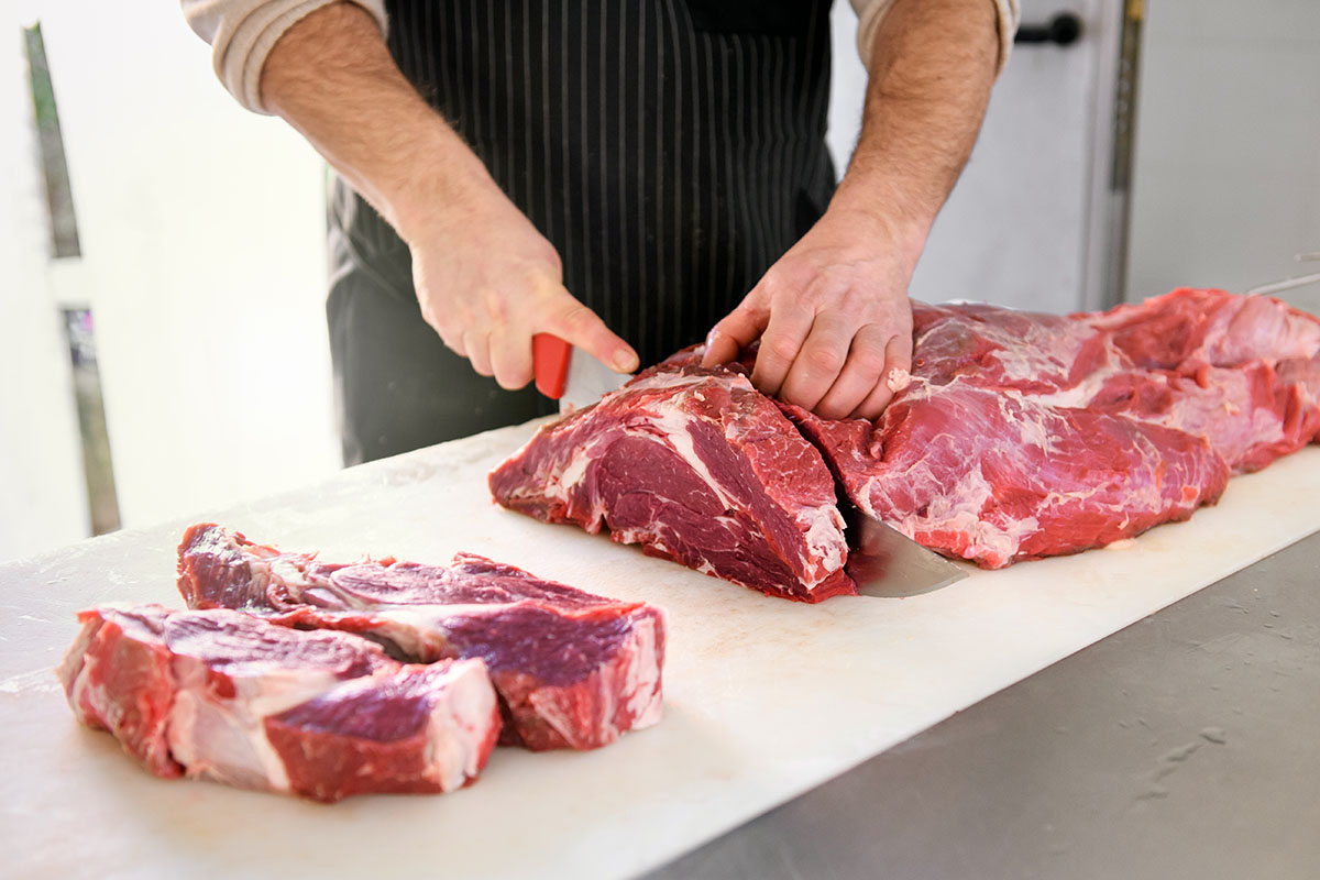 butcher or cook slicing chuck steaks 2021 08 27 12 27 22 utc